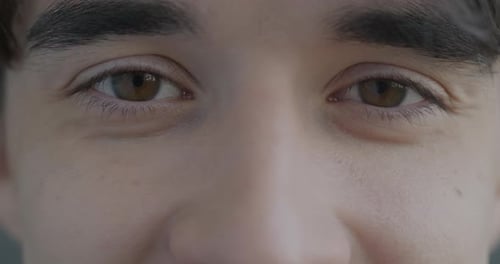 Extreme Close Up Of Young Adult Eyes
