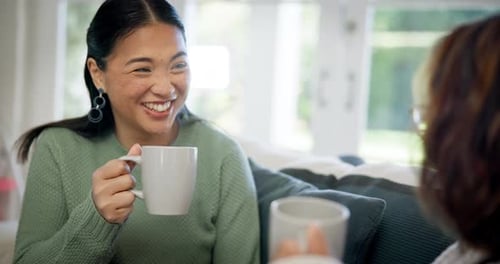Women Talking and Laughing Together Indoors