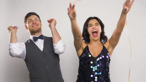 Couple Celebrating with Confetti and Joyful Dancing
