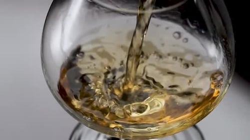 Alcohol being poured into glass