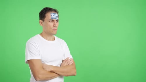 Man with Flag on Forehead Crosses Arms