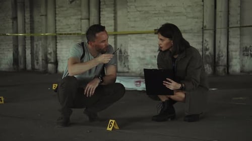 Detectives Examine Crime Scene Evidence