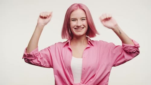 Happy Woman with Pink Hair Dancing
