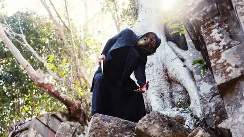 Hooded Figure with Sword on Ancient Ruins