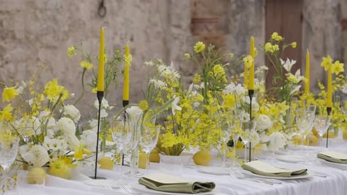 Elegant Wedding Table Decorated with Yellow Flowers