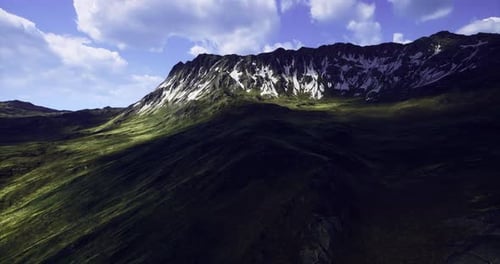 Majestic Mountain Landscape with Snowy Peaks and Lush Valleys During Daylight