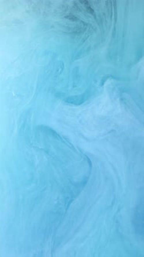 Teal Paint Dissolving in a Wispy Abstract Pattern