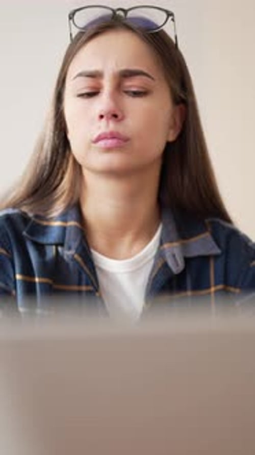 Online Education and Learning Portrait of Student Girl Typing on Laptop Vertical Video Thoughtful