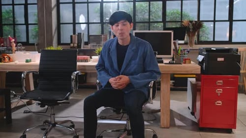 Young adult presenting in an office