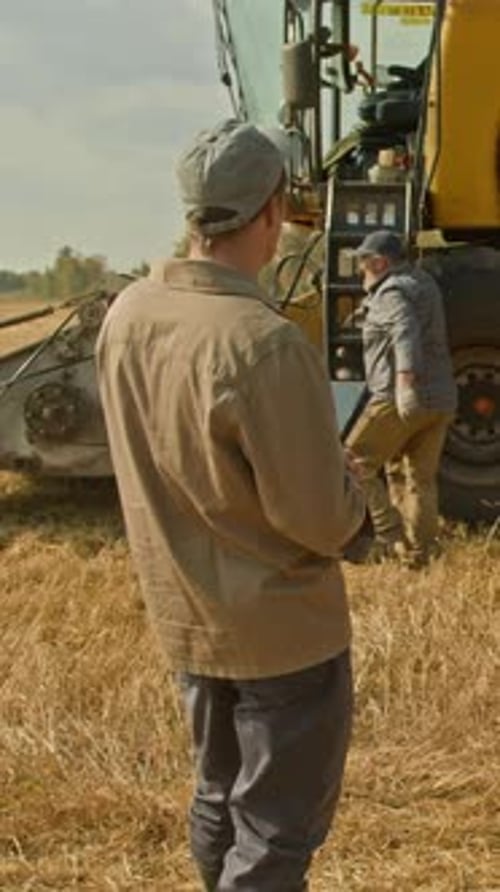 Group of Farmers in Wheat Field Vertical