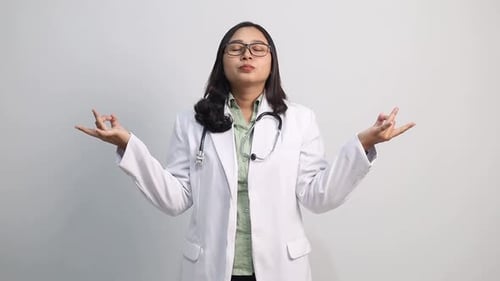 Relaxed Woman Doctor Meditating for Mental Health