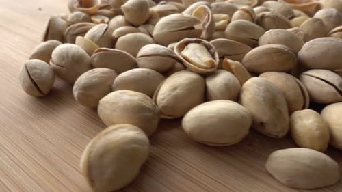 Food background. Roasted pistachio nuts seed with shell close up. Dieting concept