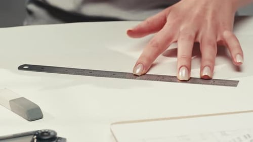Young Woman Artist is Drawing Buildings By Pencil Using Ruler on White Paper The Designer or