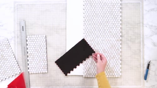 Crafter Assembling Mosaic Tiles for DIY Project