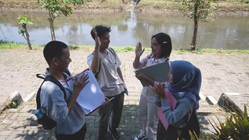 Students Celebrate Graduation Success by River