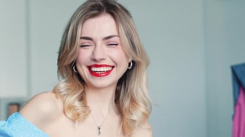 Blonde Woman Smiling with Red Lipstick Close-Up