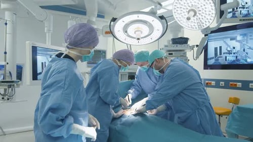Surgeons Performing Operation in Modern Operating Room