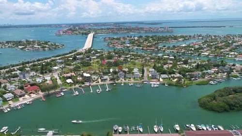 Panning aerial drone view of luxurious coastal Florida neighborhood in Pinellas county