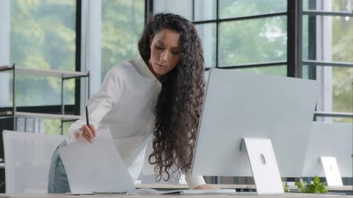 Busy Successful Businesswoman Working in Office Writing Data From Computer Beautiful Female