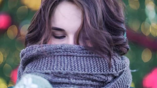 Young Woman in Scarf and Mittens Outdoors