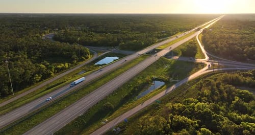 Elevated Highway Interchange in Florida with Speeding Vehicles Evening Light Over I75 Interstate