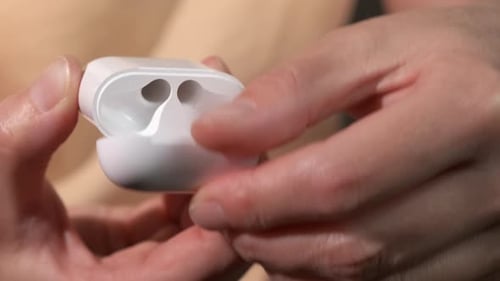Close Up of Earbuds Charging Case Being Opened