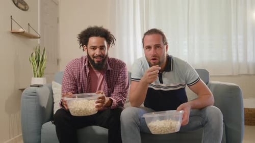 Friends Watching Sports at Home with Popcorn