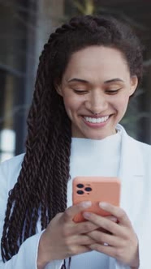 Happy Smiling Young Woman Stand Use Mobile Phone Smiling Typing on Street Relaxing Outdoors Slow