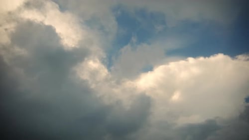 Majestic Clouds Rolling Slowly in the Daytime Sky