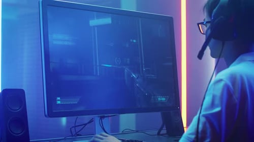 Teenager Plays First Person Shooter Video Game