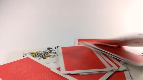 Playing Cards Falling on White Surface