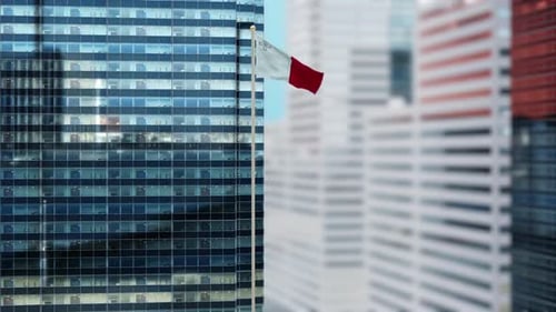 Malta Flag Waving in Front of Modern Corporate Building