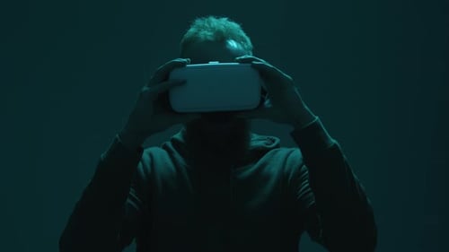 Man Putting On a Virtual Reality Headset