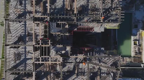 Aerial Video Aerial View of a HighRise Building Under Construction With Concrete Floors in Progress