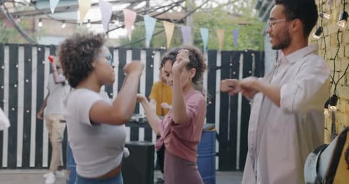Joyful Young Couple African American People Dancing and Laughing Chilling at Street Cafe Party