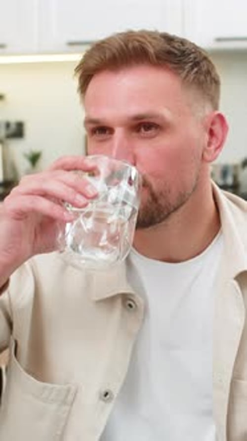 Young Man Drinks Water Big Sip Healthy Habit Hydration Focus Energy Pause Refresh Wellness Routine