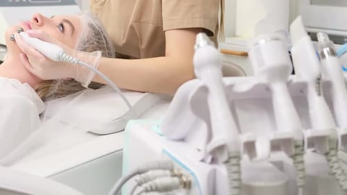 A Girl at an Appointment with a Cosmetologist in a Cosmetology Clinic a Dermatologist Massages