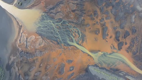Aerial video over YELLOW RIVER and flowing glaciers in Iceland landscape