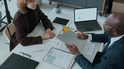 Business Deal Concluded with Handshake at Office