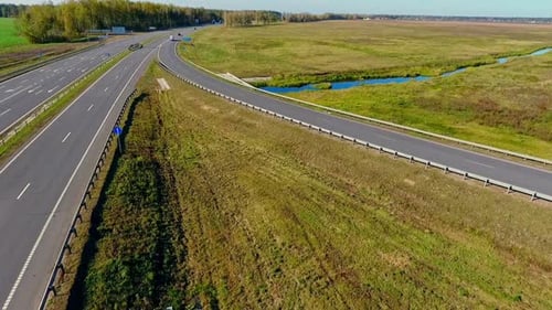 Cars and Truck Moving on Road Junction. Drone View of Highway Road