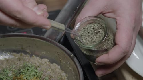 Adding thyme to the Cafe de Paris butter, close up