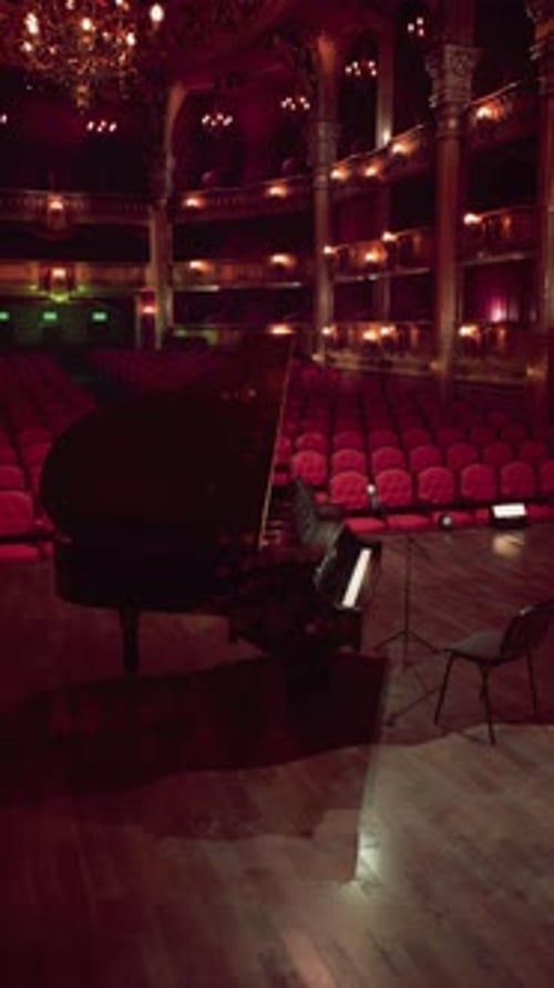 Empty Grand Piano on a Classic Theatre Stage