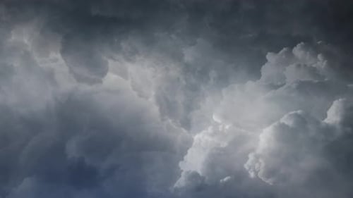 4k view of thunderstorm flying through dark cumulonimbus clouds