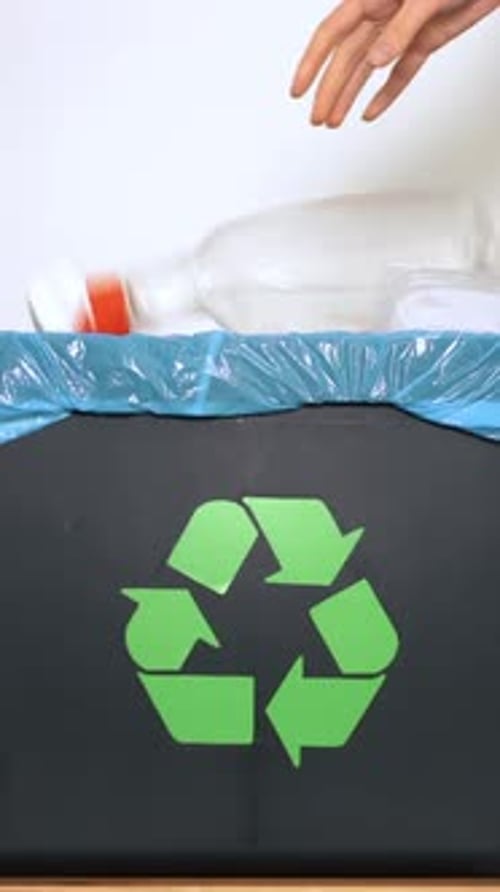 Recycling Different Plastic Items in Bin Close Up