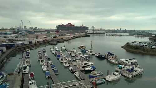 Boats Moored In Jetty With Virgin Voyages Scarlet Lady Cruise Ship Docked At Terminal Of Portsmouth
