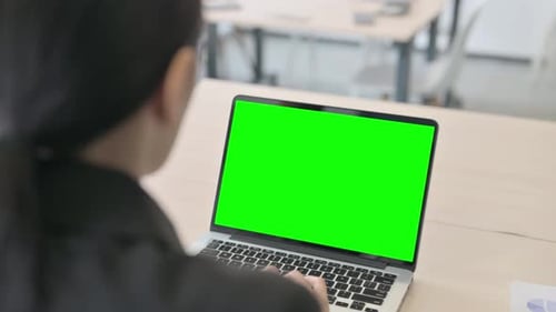 Businesswoman Using Laptop with Green Screen