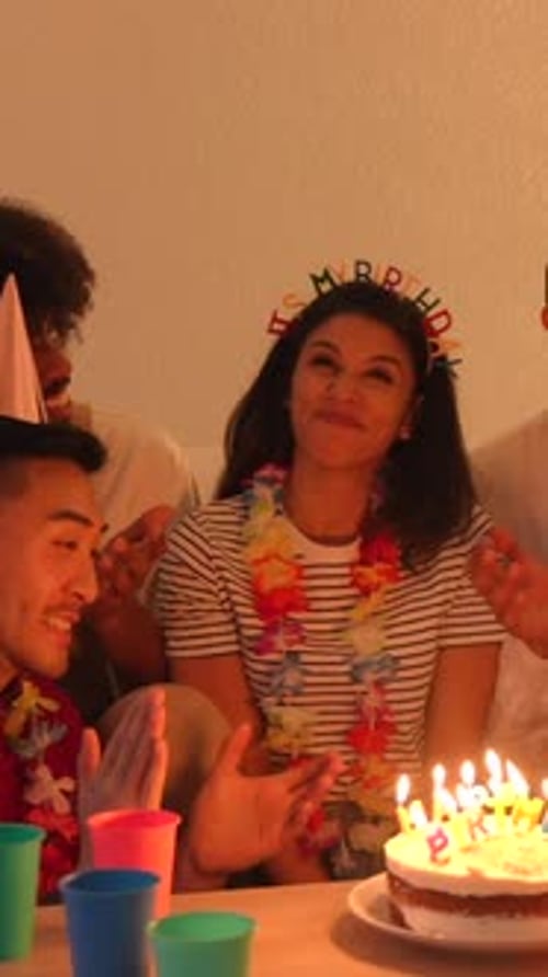 Friends Celebrating Birthday with Cake and Candles