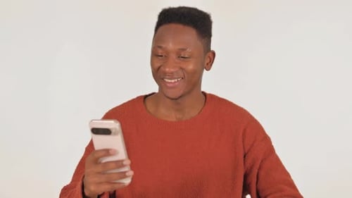 Young Adult Waving During a Video Call