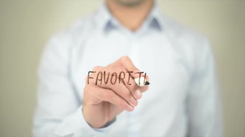 Man Writing the Word Favorite on Invisible Screen