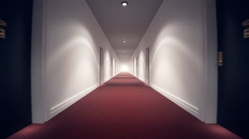 Long Empty Corridor of Hotel with Wooden Doors